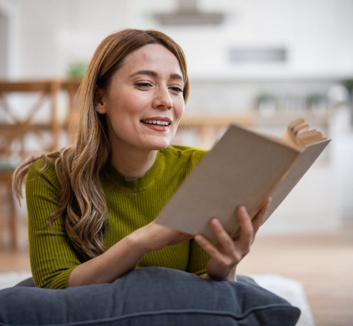 Woman reading a book indoors